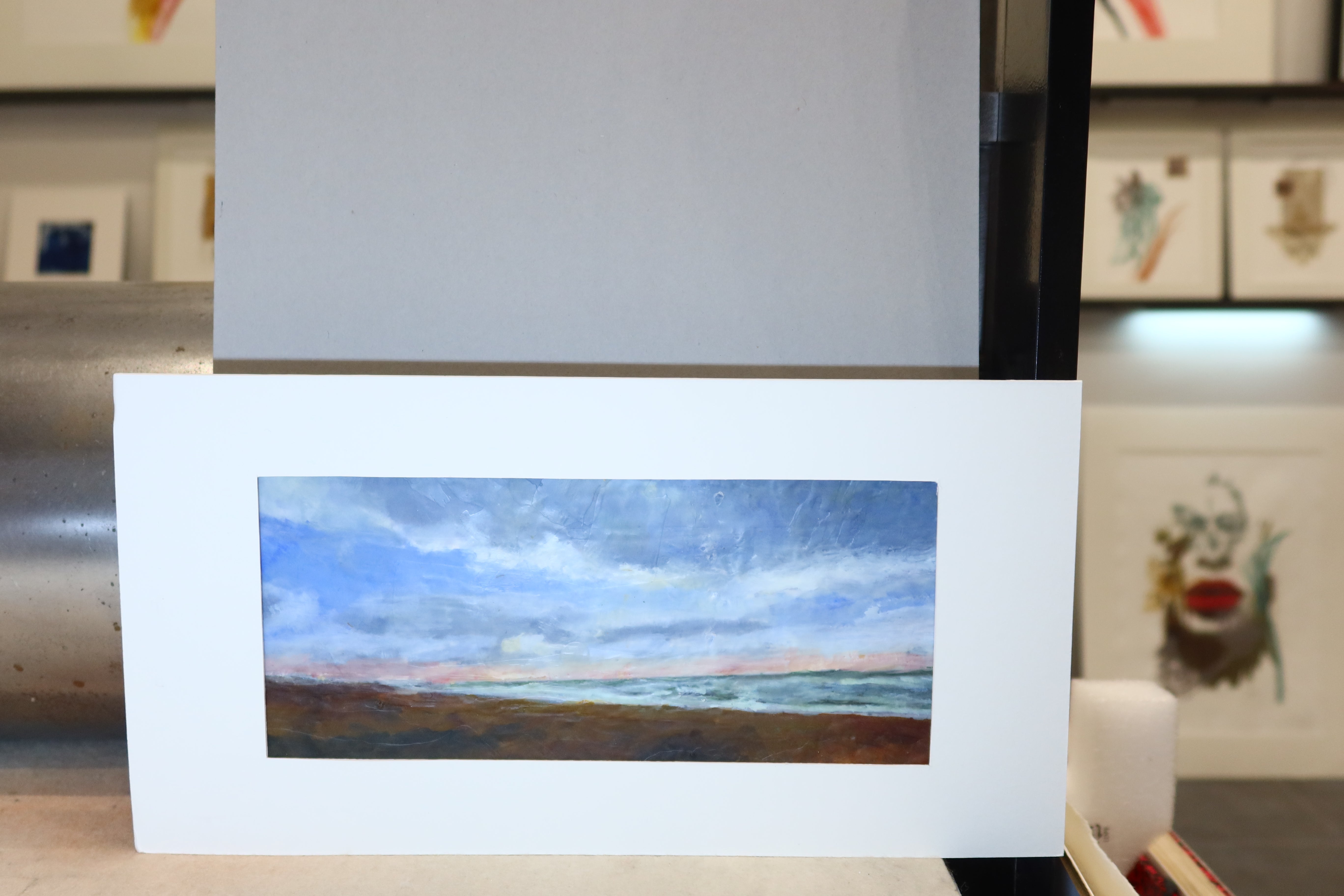 Peinture à la cire de la collection Cire représentant la mer et la plage au coucher de soleil.