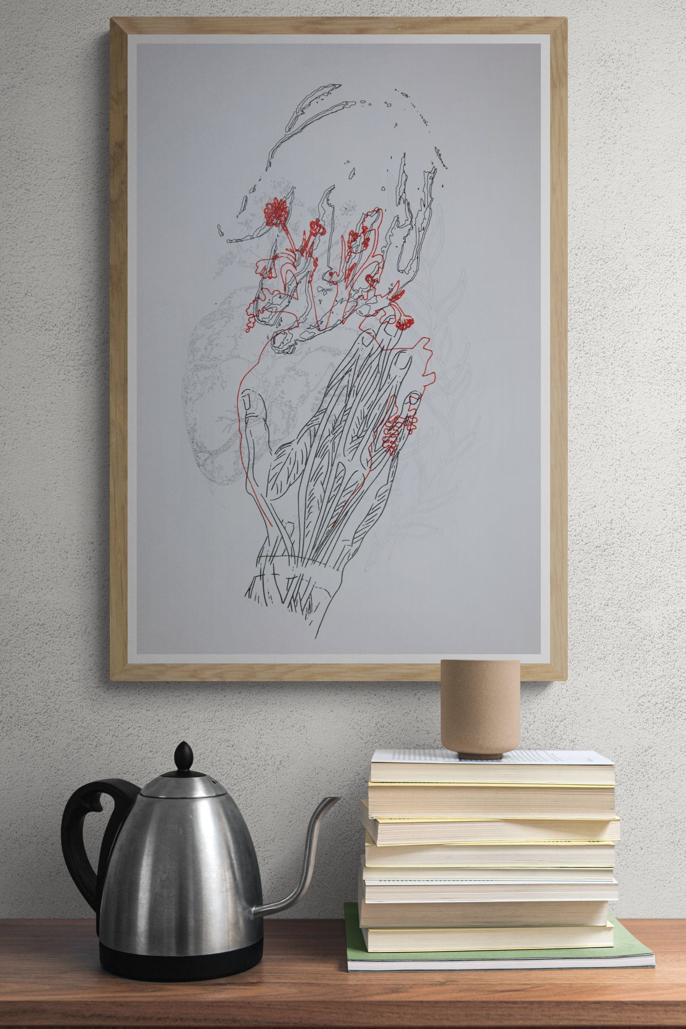 Œuvre encadrée de la collection Corpvide en mise en situation représentant une main, des fleurs et un cœur anatomique, réalisée au dessin au feutre et au crayon.