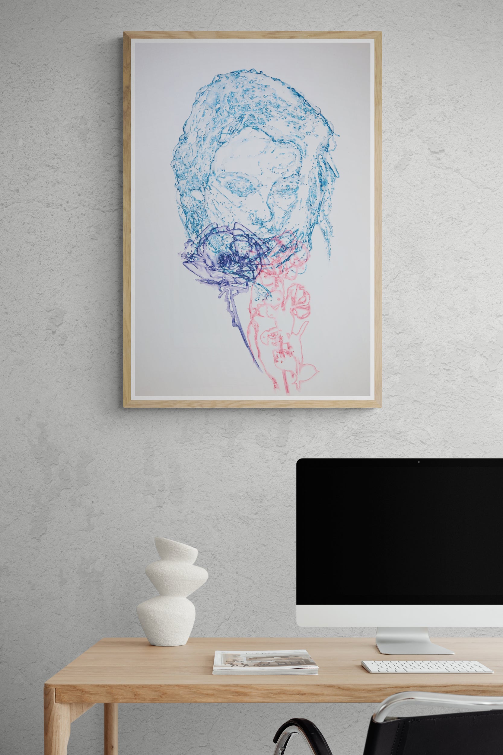 Œuvre de la collection Métamorphe encadrée, aquarelle sur papier, motif de visage et rose, au rendu délicat, présentée en intérieur.