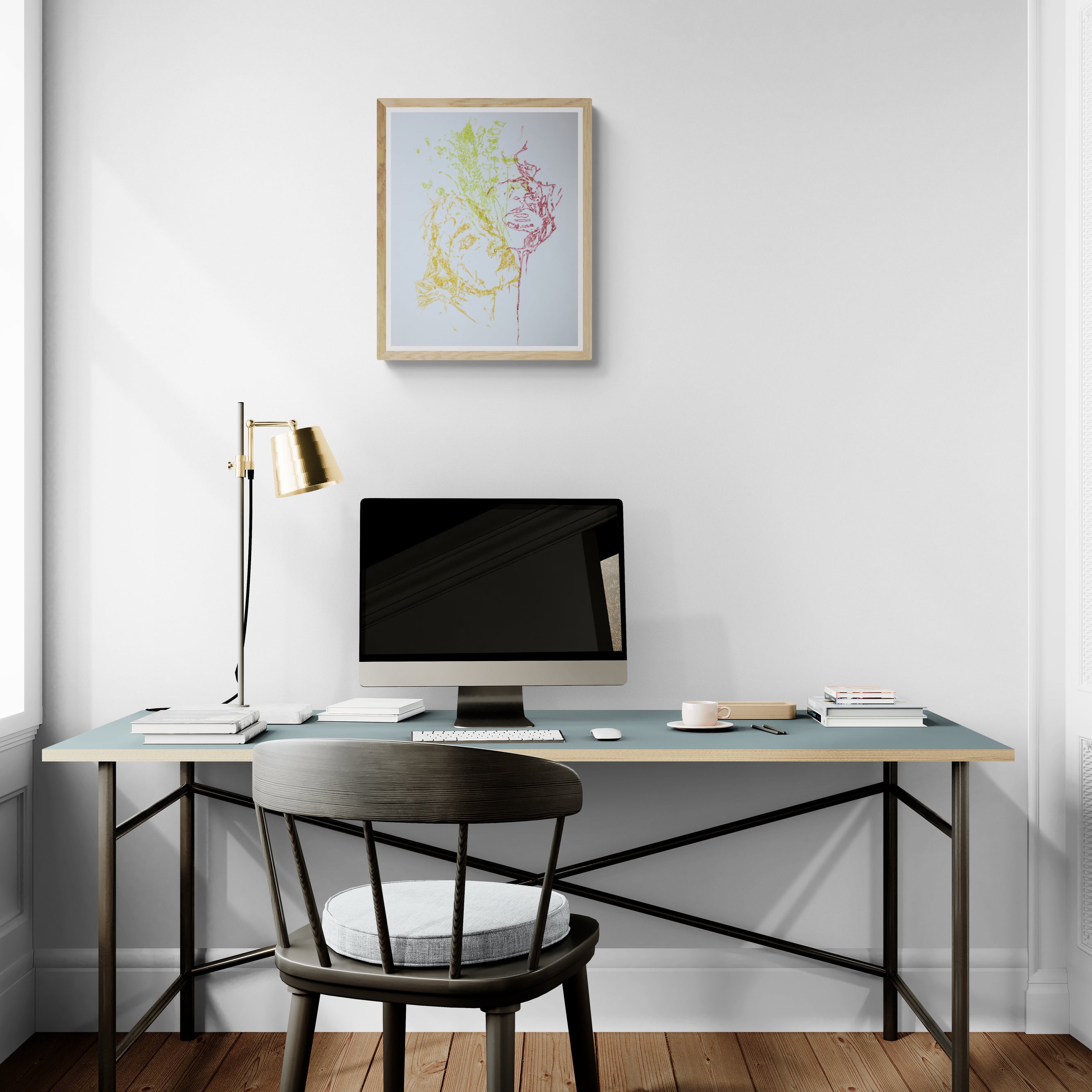 Œuvre de la collection Métamorphe encadrée, aquarelle sur papier, motif de visages entourés de feuillage, au rendu délicat, présentée en intérieur.